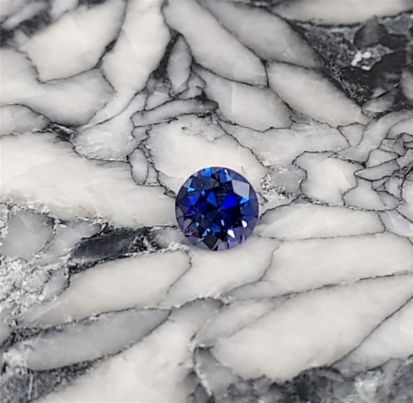 Faceted Benitoite, Round Cut, .32 cts., 4.2 mm, VVS