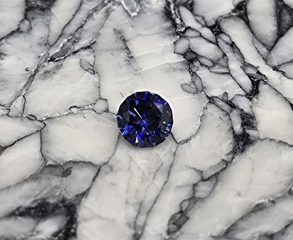 Faceted Benitoite, Round Cut, .67 cts., 5.1 mm, VVS