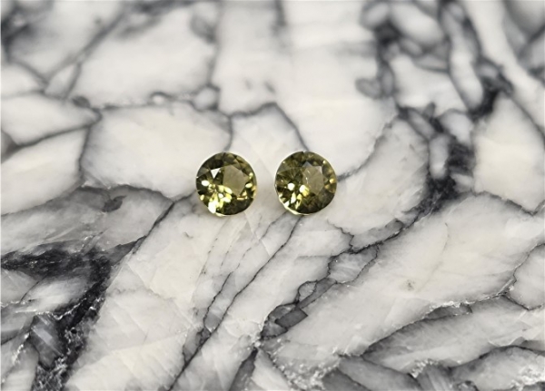 Pallasitic Peridot Matched Pair, .10 cts., 3.0 mm each, with G.I.A. Reports